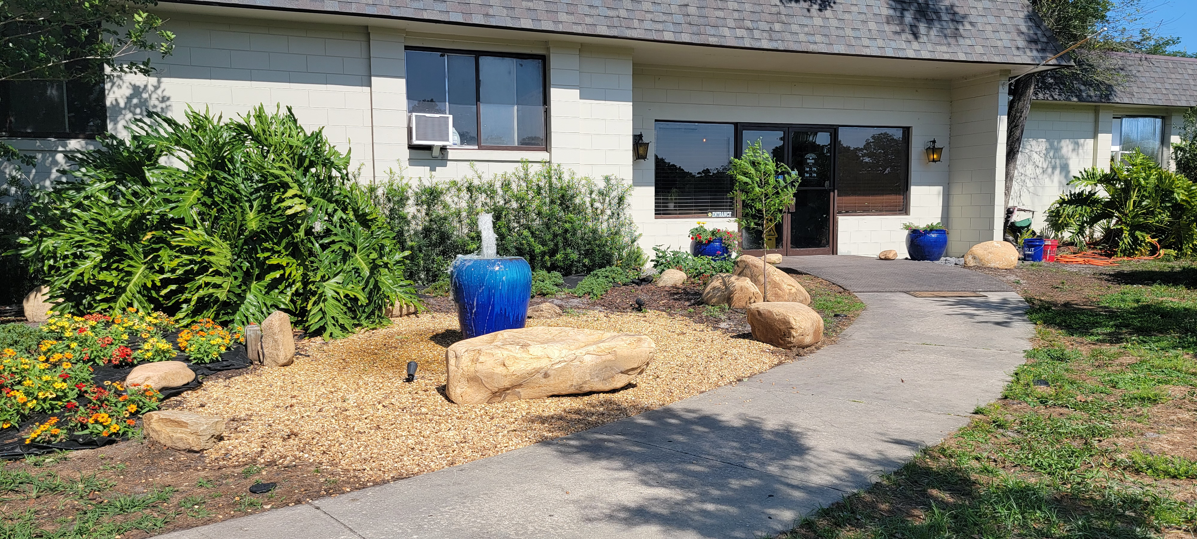 The landscaped entrance to Must Love Dogs Resort